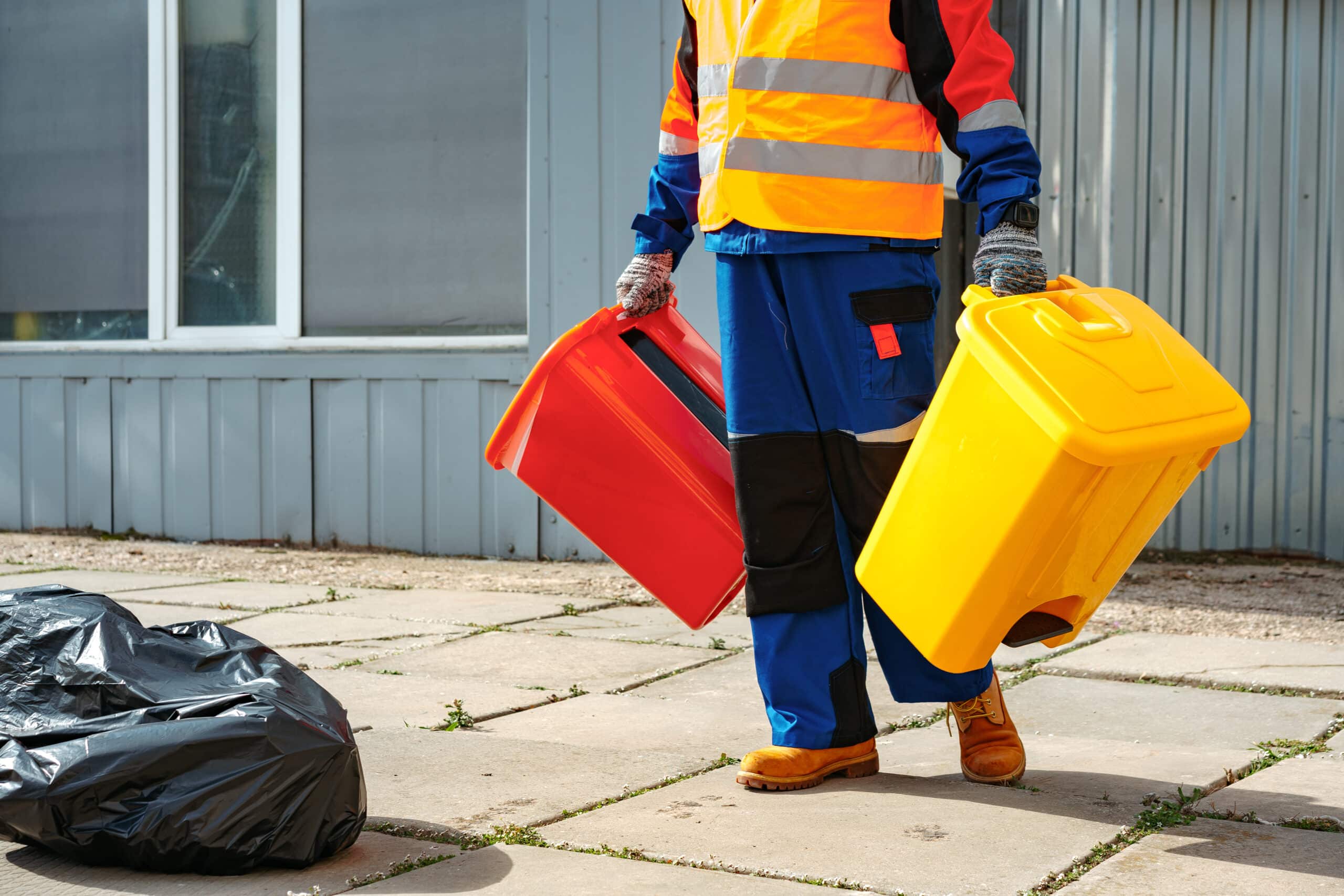 male janitor in uniform cleans a trash can in the 2023 11 27 05 14 31 utc scaled